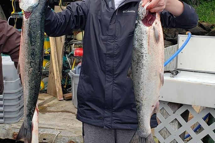 a person holding a fish