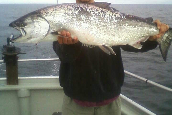 a person holding a fish