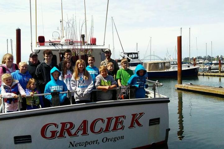 a group of people on a boat in the water