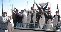 a group of people riding on the back of a boat