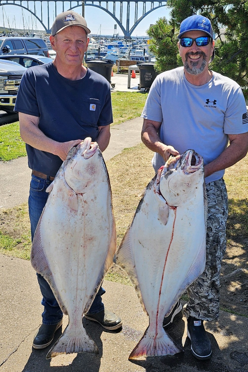IMG_20240622_180423~2 two men holding big halibut
